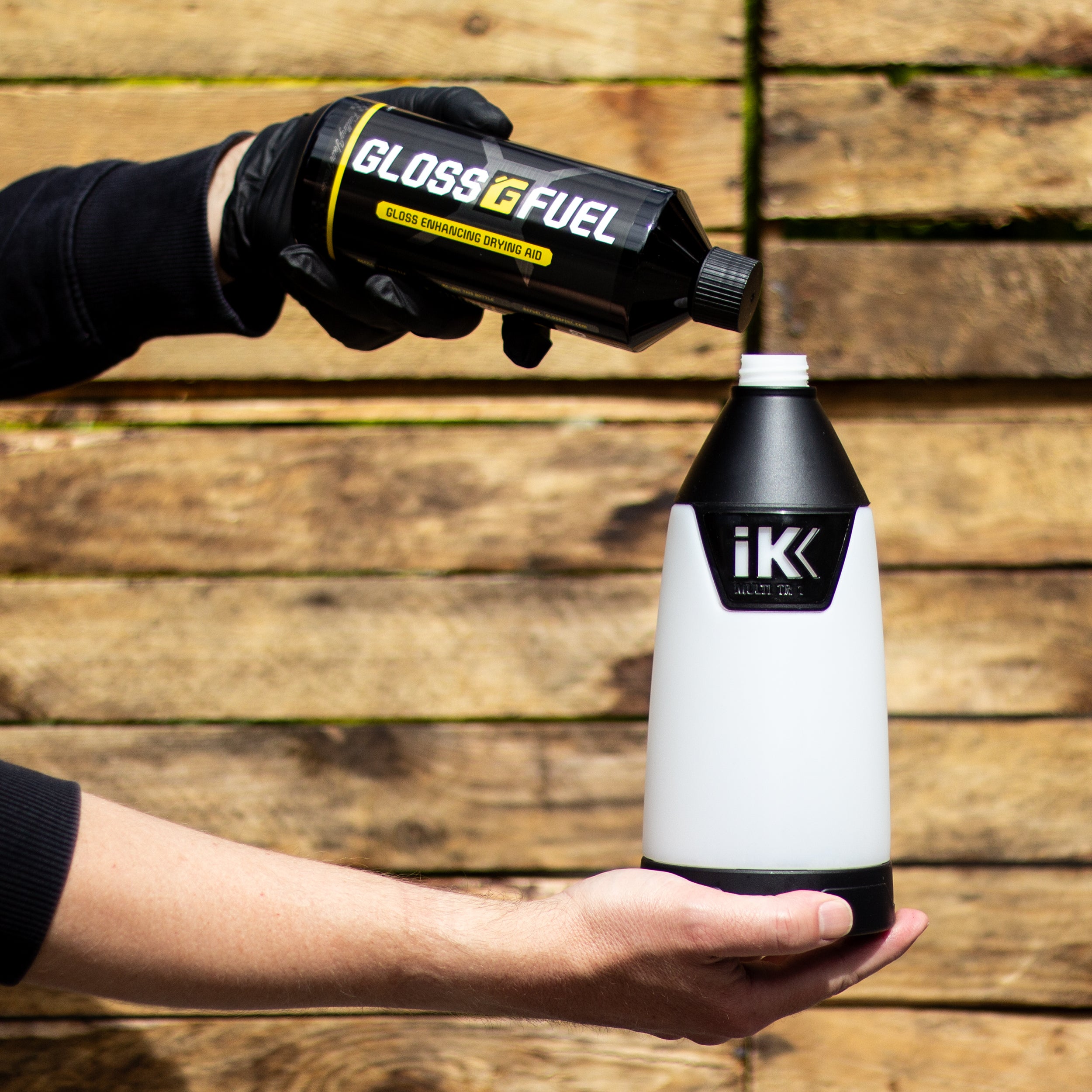 Gloss Fuel Gloss Enhancing Drying Aid being poured into an IK Trigger Sprayer