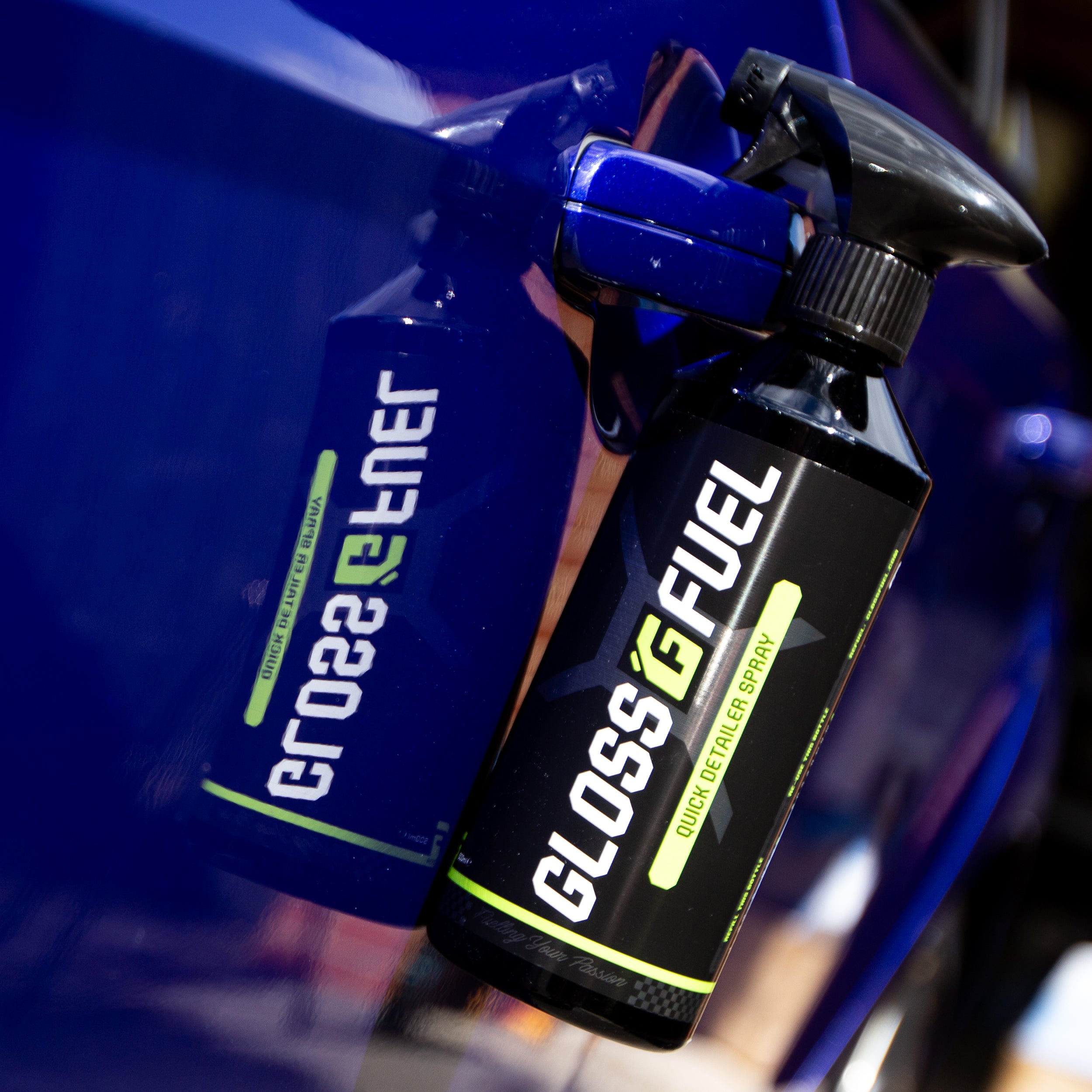 Gloss Fuel Quick Detailer Spray Trigger Spray Bottle Reflecting in a Car Door
