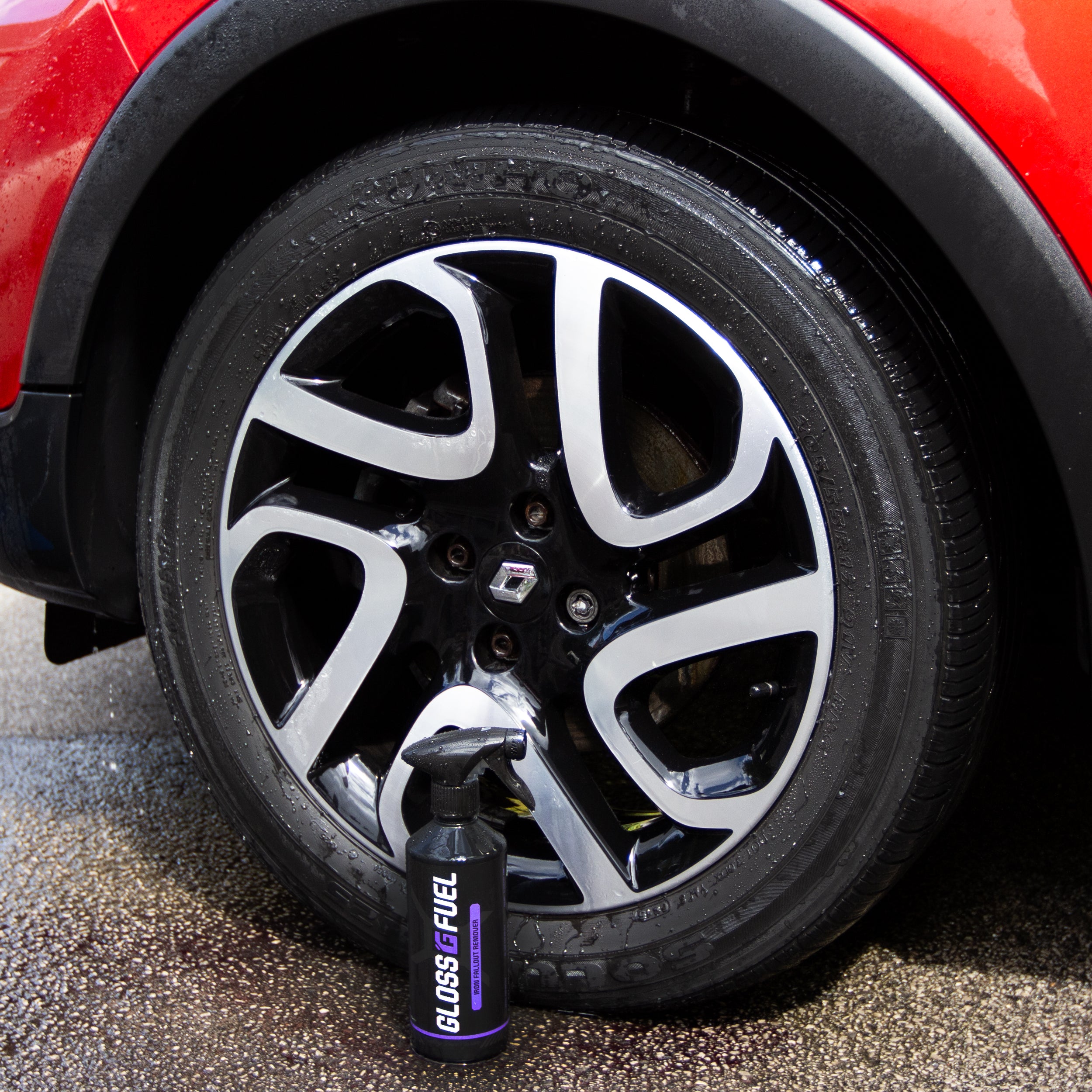 Gloss Fuel Iron Fallout Remover bottle next to a freshly cleansed alloy wheel