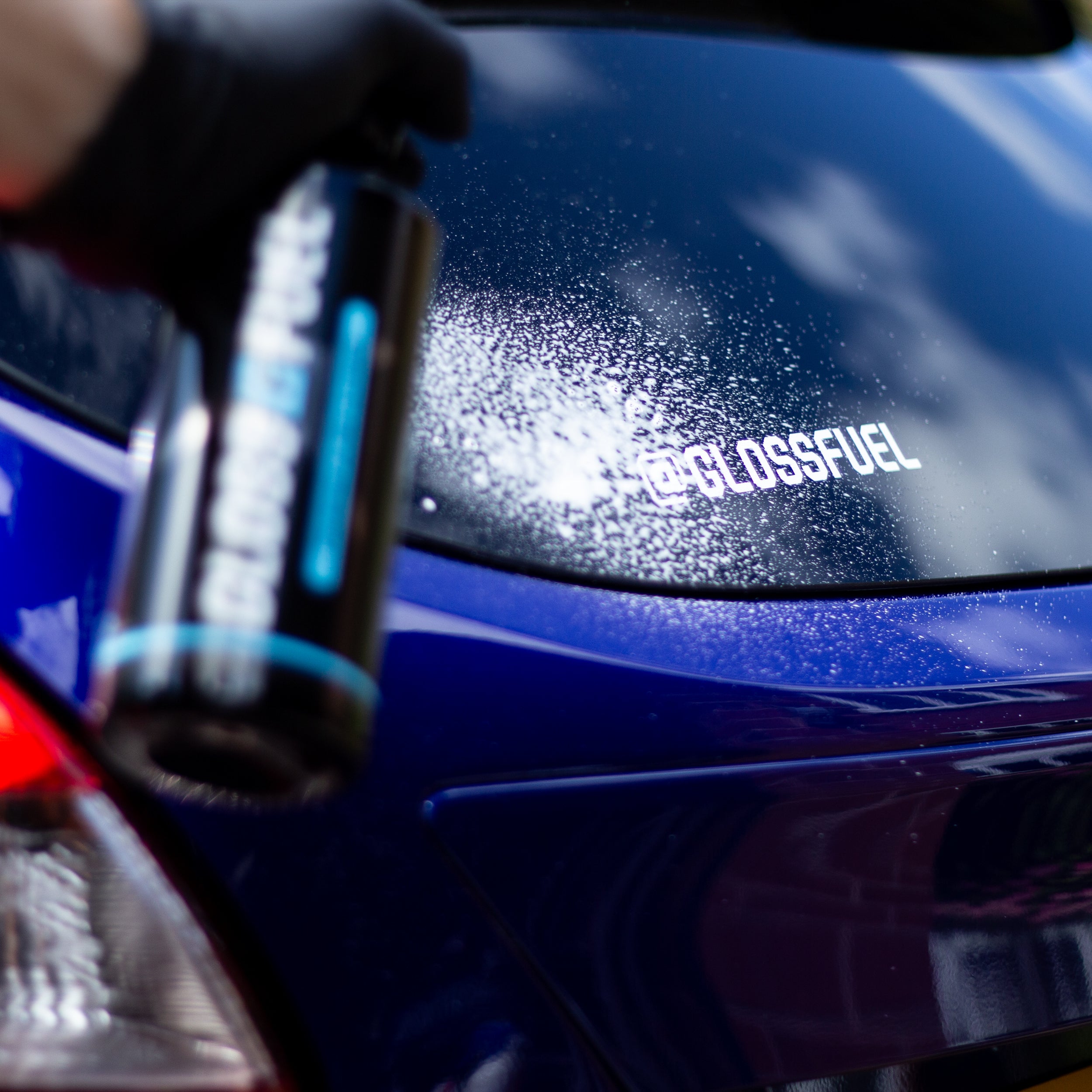 Gloss Fuel Premium Glass Cleaner being sprayed onto Ford Focus ST glass